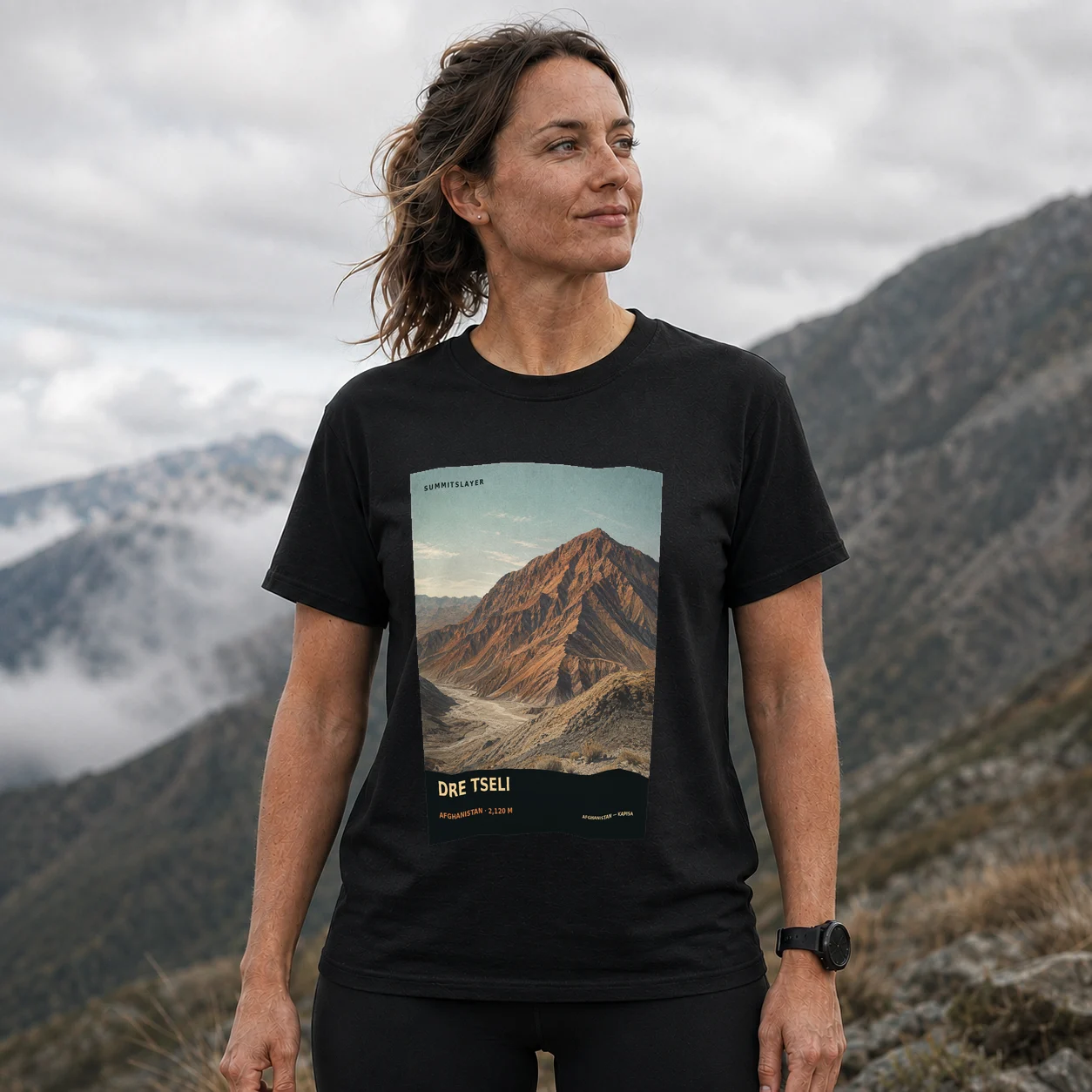 Black Drē Tsêlaī T-shirt front with mountain artwork