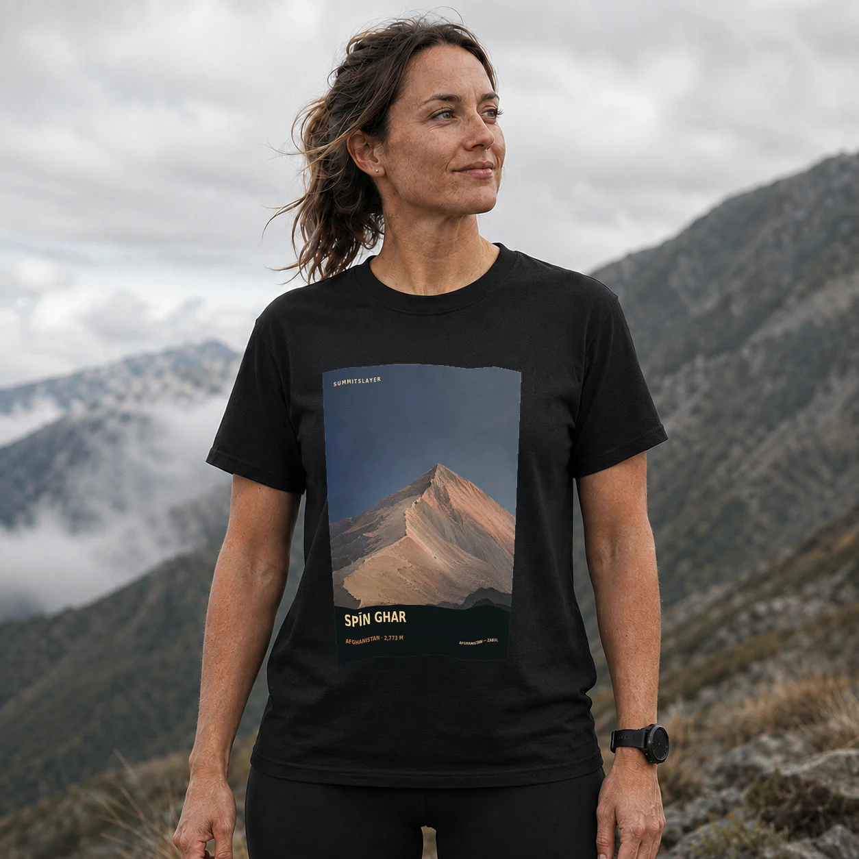 Black Spīn Ghar T-shirt front with mountain artwork